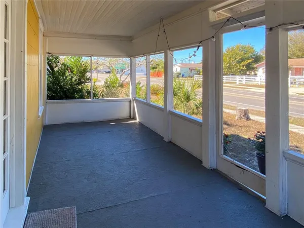 a view of room with window and floor to ceiling window