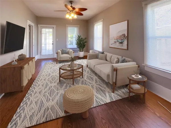 a living room with furniture and a flat screen tv