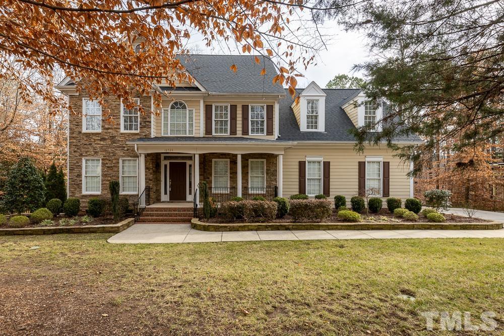 12724 Amoretto Way Raleigh, NC 27613 - Photo 1 of 44 a front view of a building with lot of windows