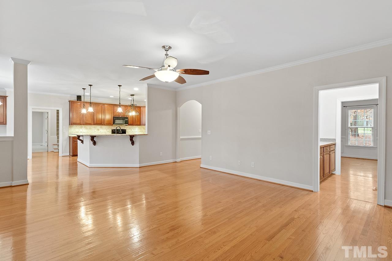 12724 Amoretto Way Raleigh, NC 27613 - Photo 11 of 44 a view of a kitchen with microwave and furniture