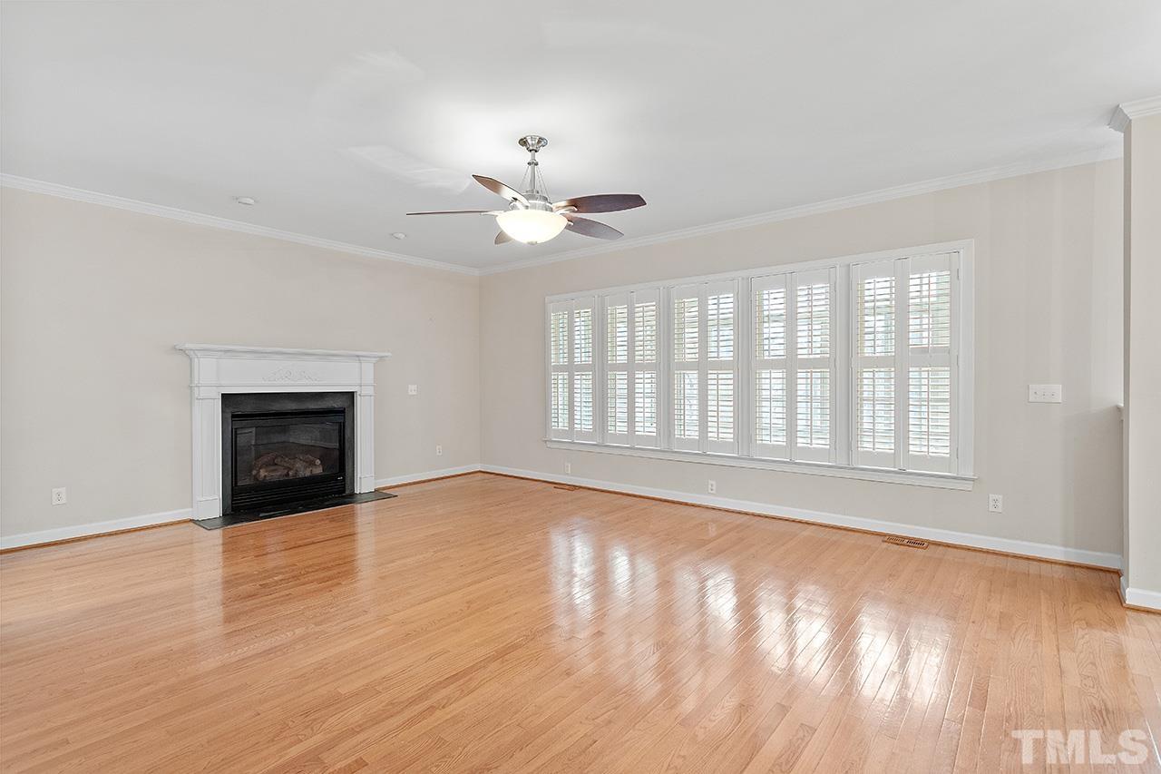 12724 Amoretto Way Raleigh, NC 27613 - Photo 13 of 44 a view of an empty room with glass door and a window