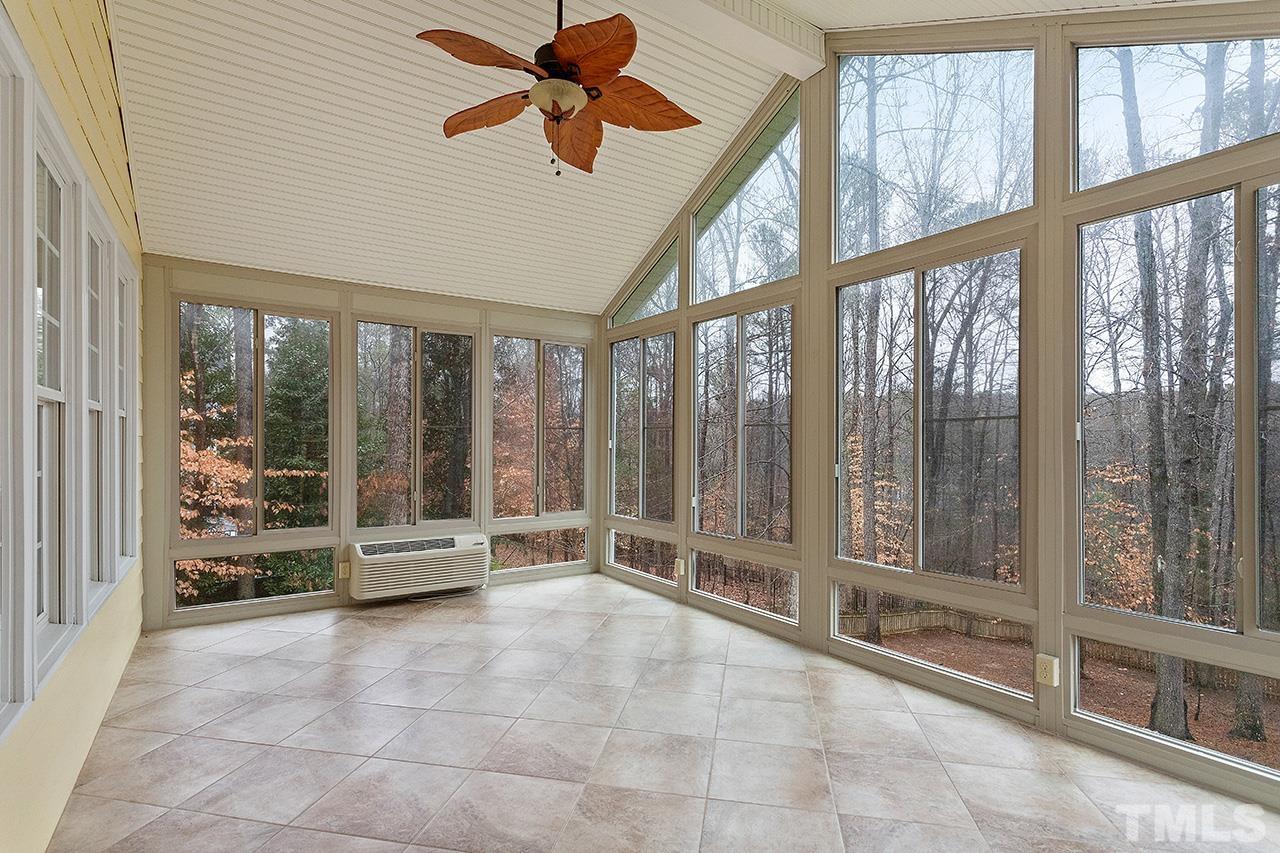 12724 Amoretto Way Raleigh, NC 27613 - Photo 17 of 44 a view of an entryway with a floor to ceiling window