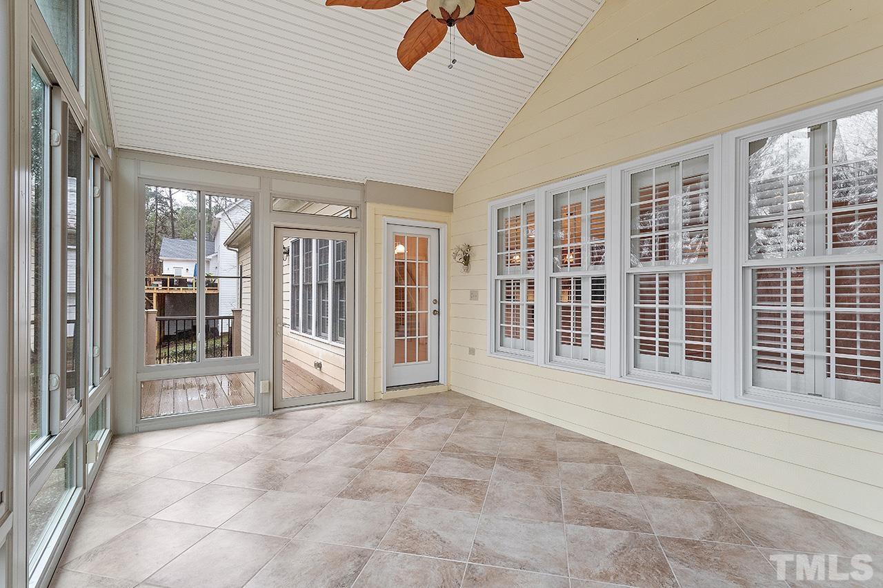 12724 Amoretto Way Raleigh, NC 27613 - Photo 18 of 44 a view of an empty room with glass door and balcony