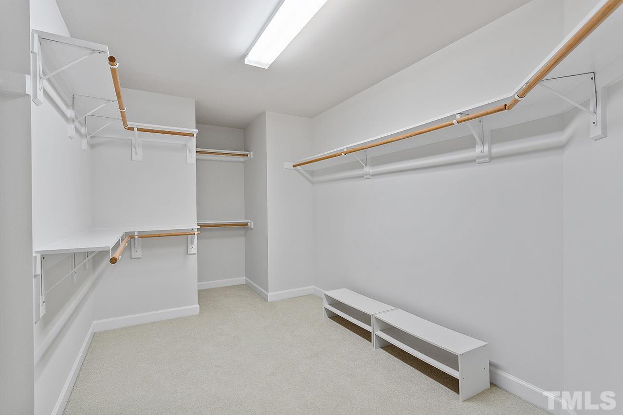 12724 Amoretto Way Raleigh, NC 27613 - Photo 30 of 44 a view of room with racks on the wall