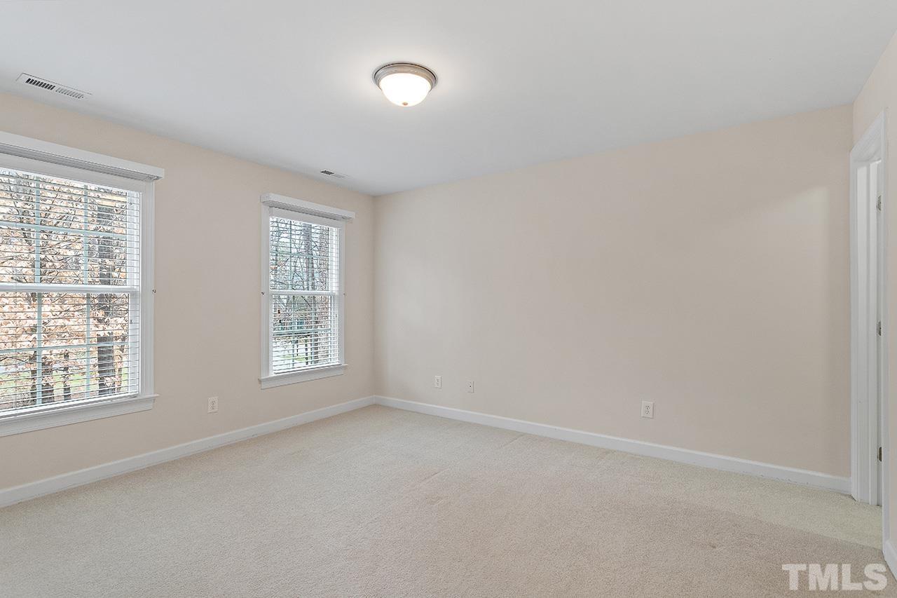 12724 Amoretto Way Raleigh, NC 27613 - Photo 32 of 44 an empty room with a window