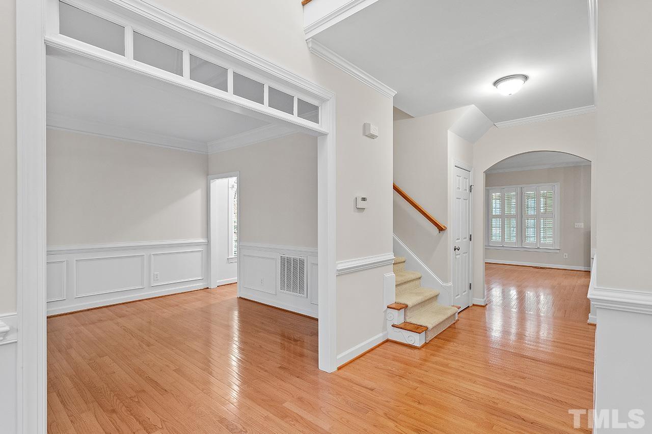12724 Amoretto Way Raleigh, NC 27613 - Photo 4 of 44 a view of entryway with wooden floor and stairs