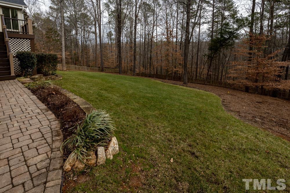 12724 Amoretto Way Raleigh, NC 27613 - Photo 43 of 44 a backyard of a house with lots of green space