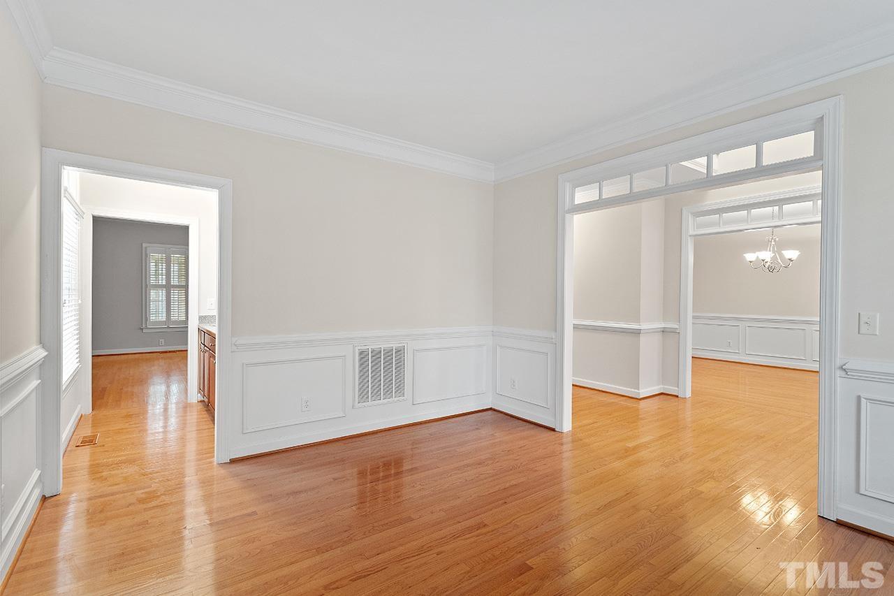 12724 Amoretto Way Raleigh, NC 27613 - Photo 9 of 44 a view of empty room with wooden floor