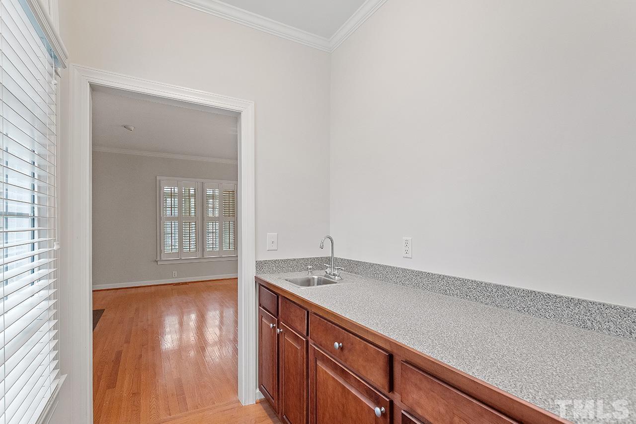 12724 Amoretto Way Raleigh, NC 27613 - Photo 10 of 44 a view of a kitchen with sink and dishwasher