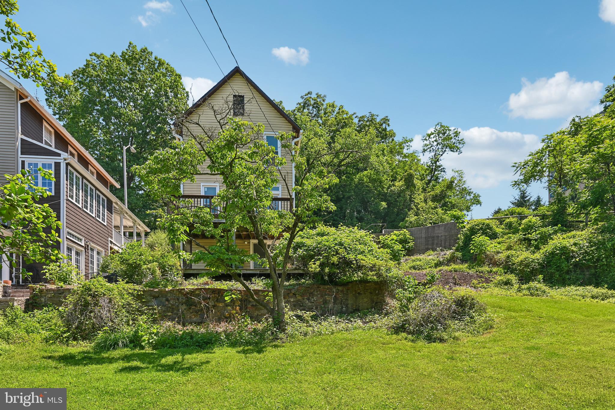 5702 Falls Road Baltimore, MD 21209 - Photo 40 of 49 a view of a house with a yard and plants