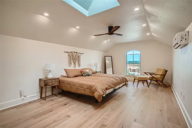 a bedroom with a bed and a table in it