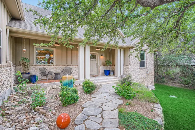 a front view of a house with garden