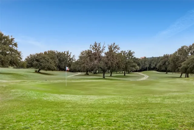 a view of a golf course with green space