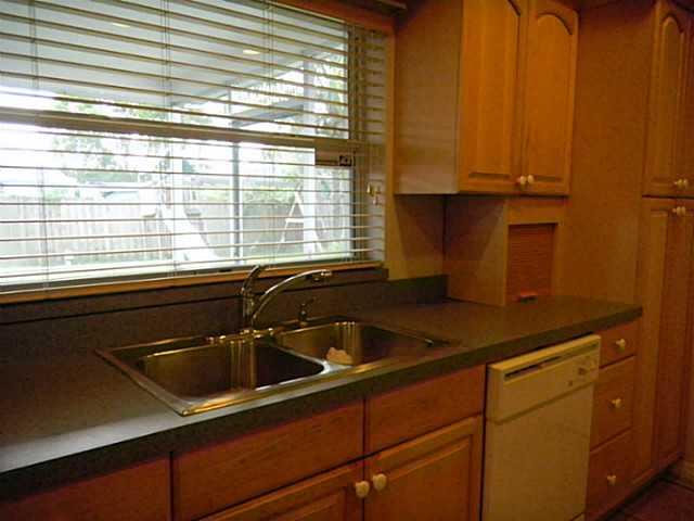 2080 Southeast Madison Street Stuart, FL 34997 - Photo 11 of 25 a kitchen with a sink and cabinets