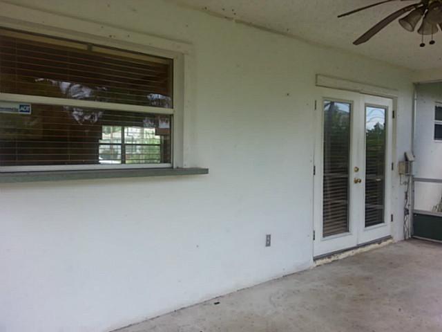 2080 Southeast Madison Street Stuart, FL 34997 - Photo 13 of 25 a view of an empty room with a fireplace and a window