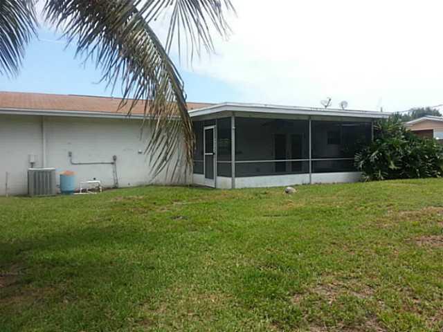 2080 Southeast Madison Street Stuart, FL 34997 - Photo 15 of 25 a house with swimming pool in front of it