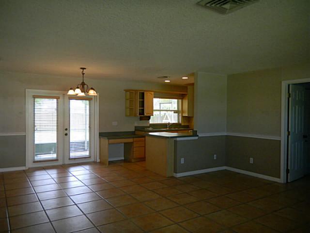 2080 Southeast Madison Street Stuart, FL 34997 - Photo 2 of 25 a kitchen with a sink and cabinets