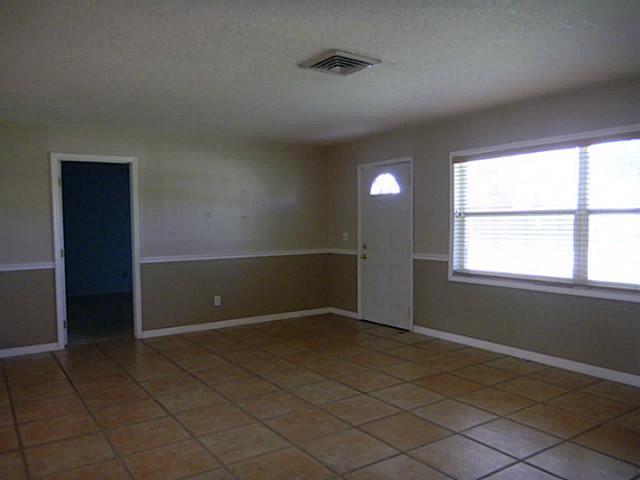 2080 Southeast Madison Street Stuart, FL 34997 - Photo 3 of 25 a view of an empty room with a window