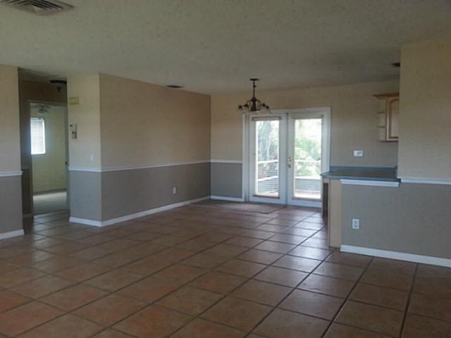 2080 Southeast Madison Street Stuart, FL 34997 - Photo 6 of 25 an empty room with a empty space and windows
