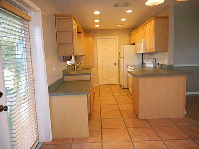 2080 Southeast Madison Street Stuart, FL 34997 - Photo 10 of 25 a kitchen with stainless steel appliances granite countertop a sink and a stove