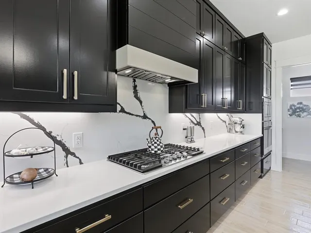 a kitchen with a sink and cabinets