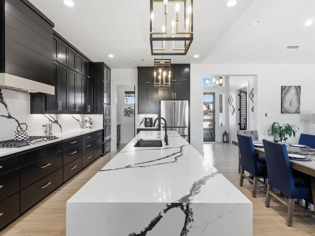 2016 Sonora Way Poolville, TX 76487 - Photo 14 of 40 a large kitchen with stainless steel appliances lots of counter space and breakfast area