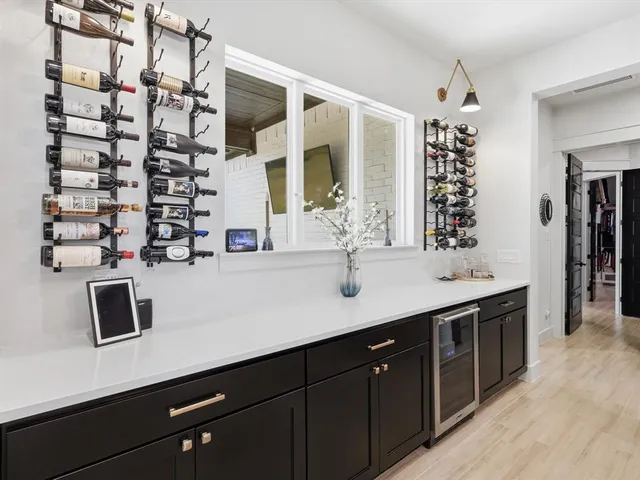 a kitchen with a sink and a refrigerator