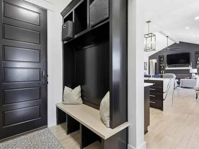 a kitchen with stainless steel appliances kitchen island granite countertop a refrigerator and a stove top oven