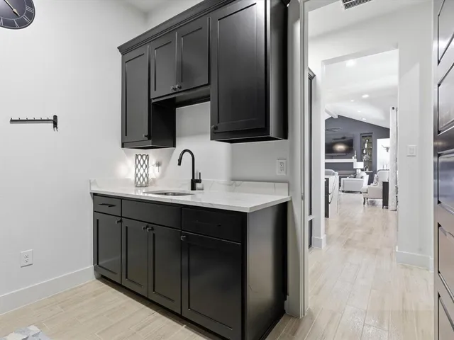a en suite bathroom with a sink and mirror