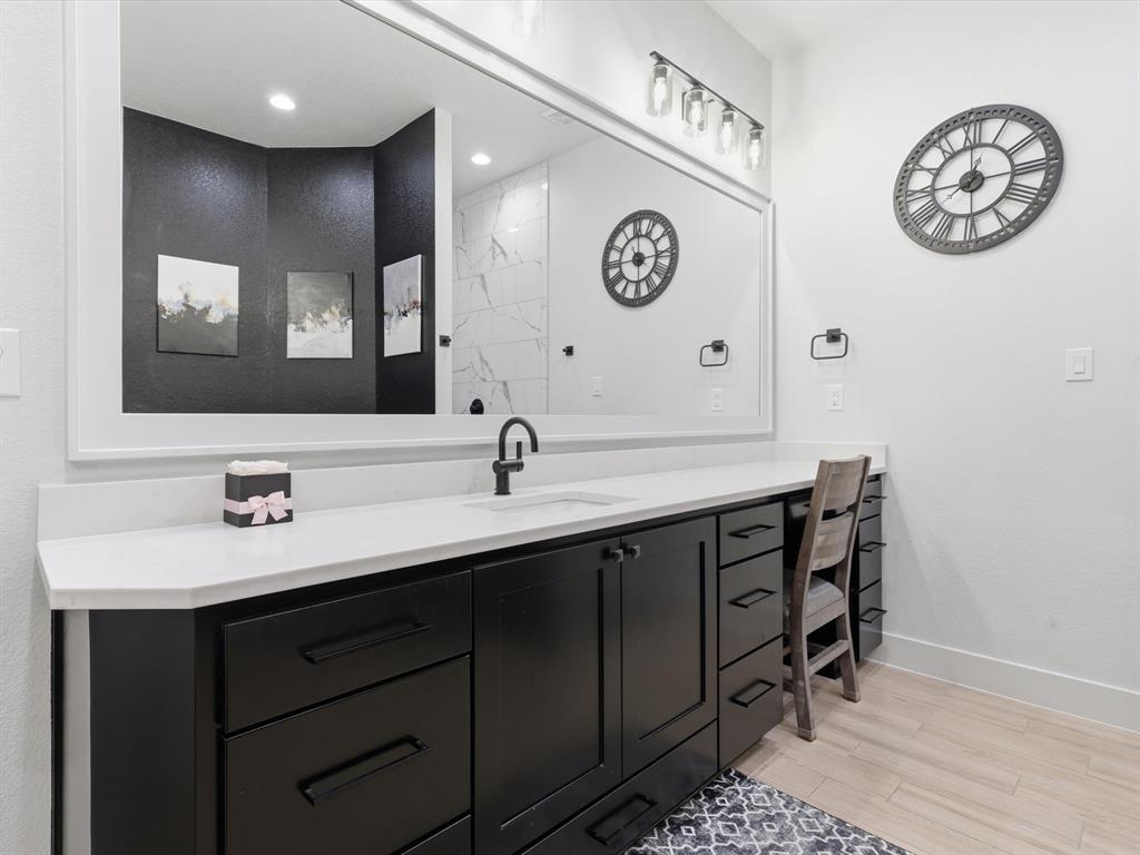 2016 Sonora Way Poolville, TX 76487 - Photo 30 of 40 a bathroom with a sink and a mirror