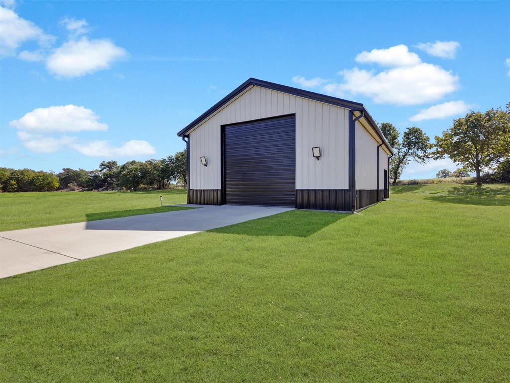 2016 Sonora Way Poolville, TX 76487 - Photo 3 of 40 a view of a backyard with a garden