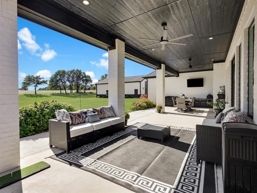 2016 Sonora Way Poolville, TX 76487 - Photo 34 of 40 a living room with patio furniture and a garden
