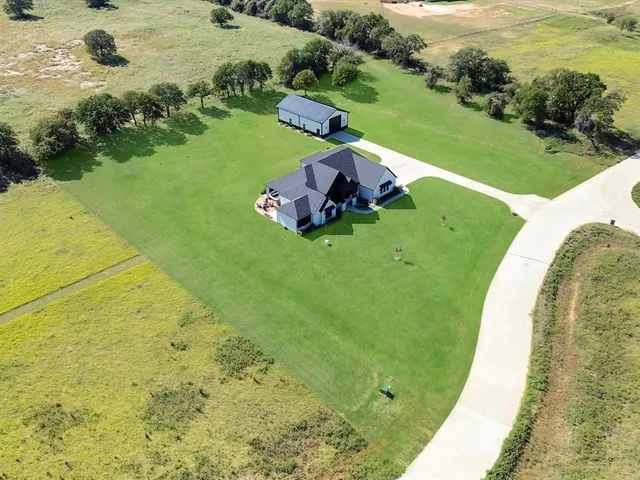 a view of a swimming pool with a garden