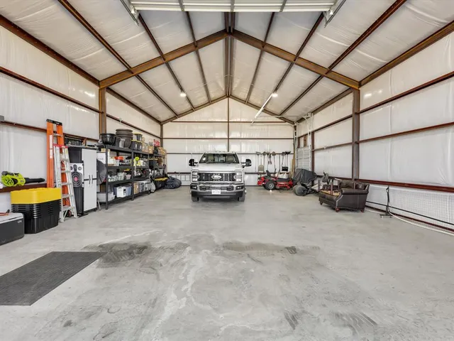 a view of parking garage with cars