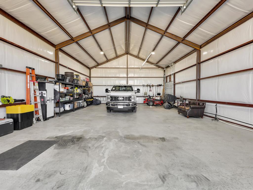 2016 Sonora Way Poolville, TX 76487 - Photo 4 of 40 a view of parking garage with cars