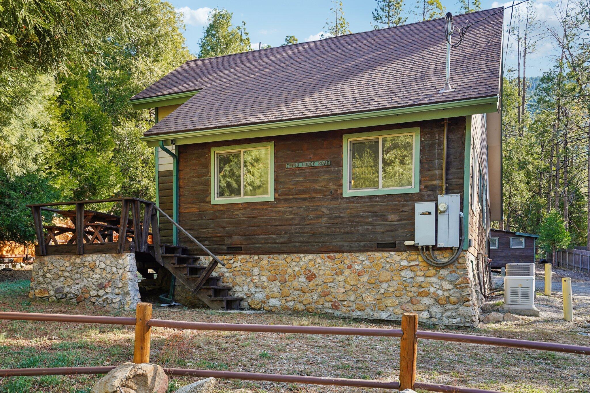 25140 Lodge Road Idyllwild, CA 92549 - Photo 2 of 35 a front view of a house with garden