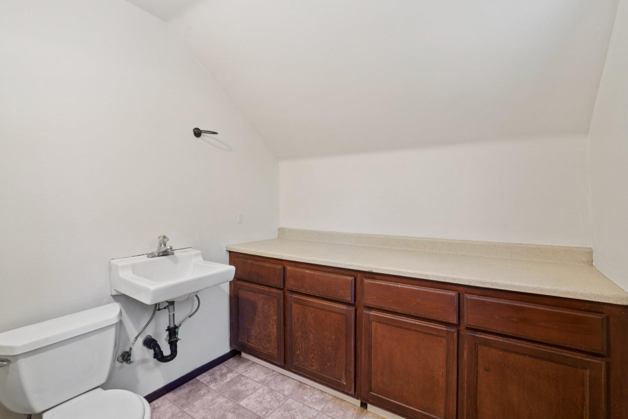 25140 Lodge Road Idyllwild, CA 92549 - Photo 25 of 35 a bathroom with a sink toilet and mirror