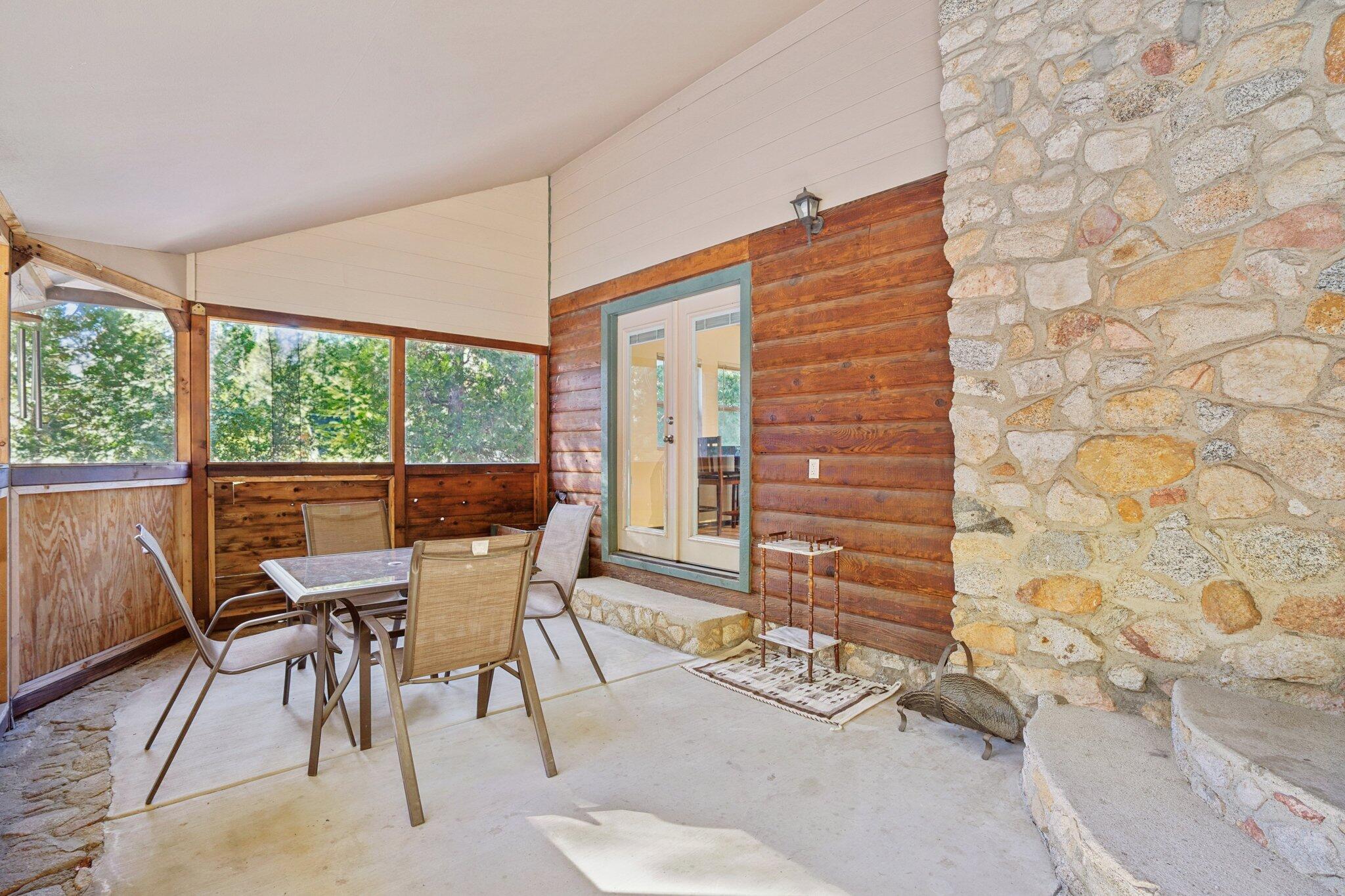 25140 Lodge Road Idyllwild, CA 92549 - Photo 26 of 35 a view of a dining room with furniture and wooden floor
