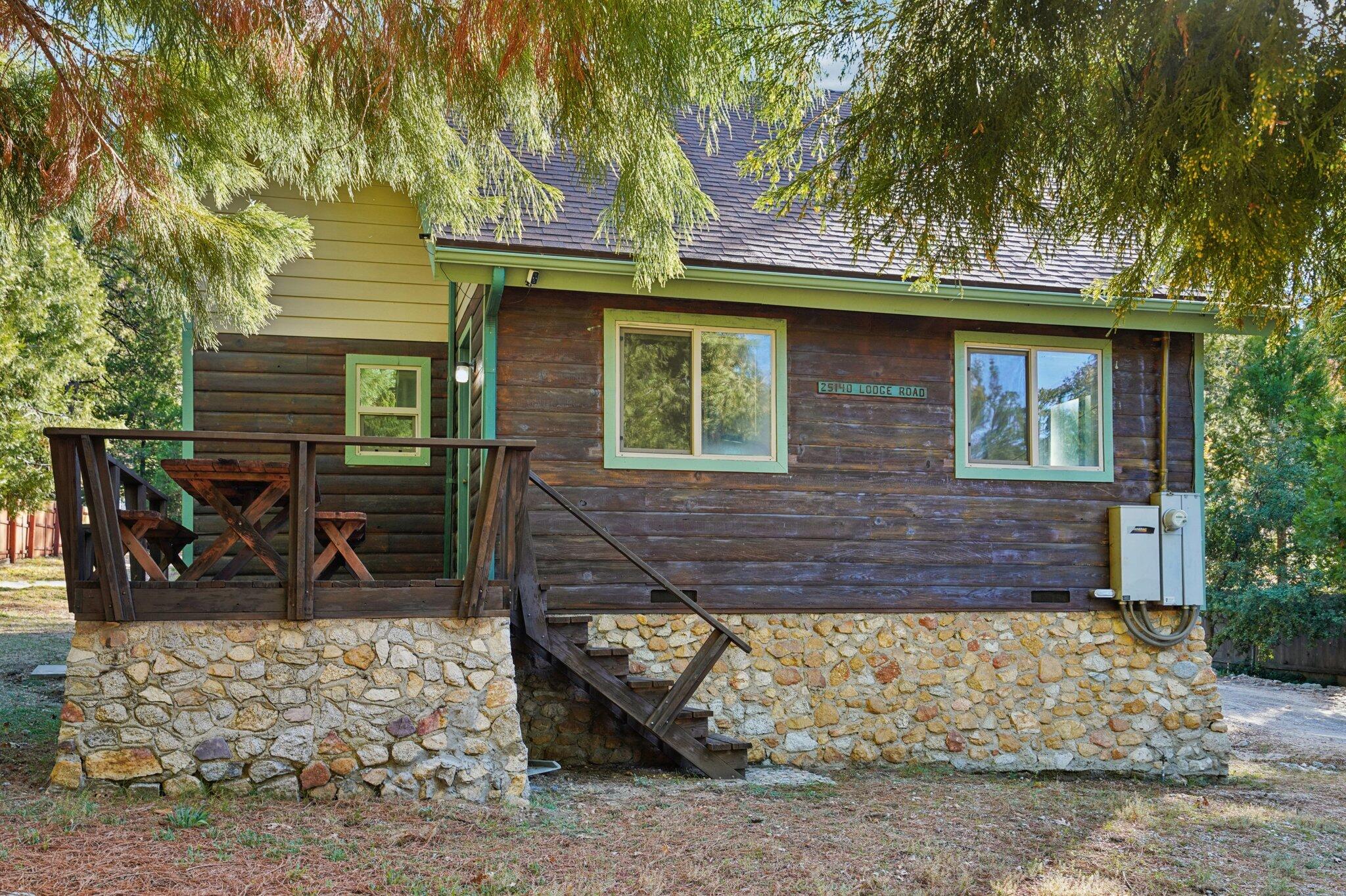 25140 Lodge Road Idyllwild, CA 92549 - Photo 3 of 35 a front view of a house with garden