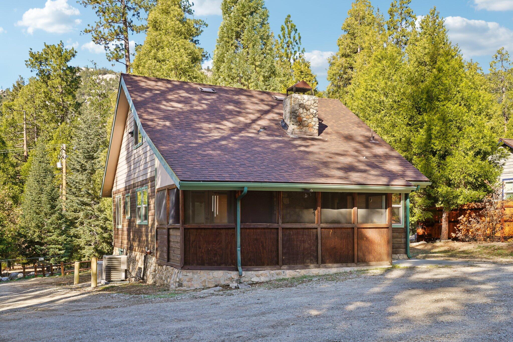 25140 Lodge Road Idyllwild, CA 92549 - Photo 31 of 35 a house with a tree in front of it