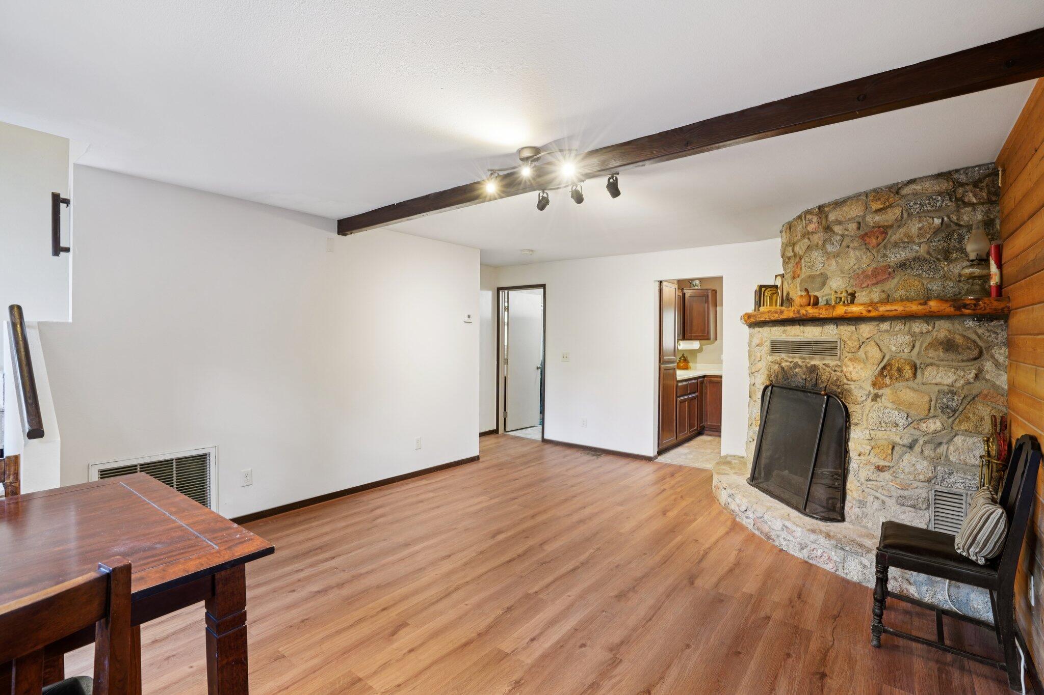 25140 Lodge Road Idyllwild, CA 92549 - Photo 7 of 35 a view of a livingroom with furniture and a fireplace