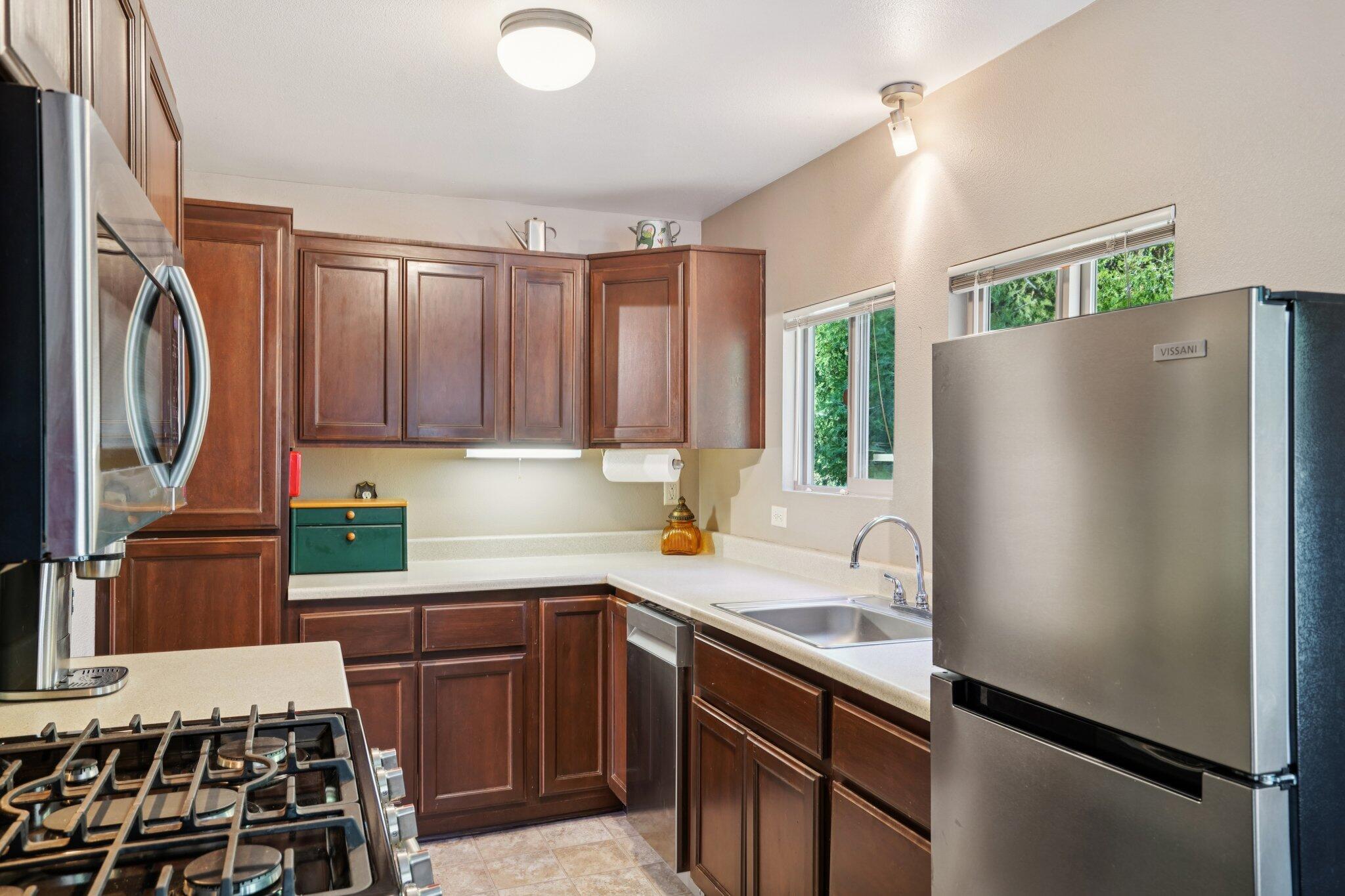 25140 Lodge Road Idyllwild, CA 92549 - Photo 10 of 35 a kitchen with a refrigerator and a sink