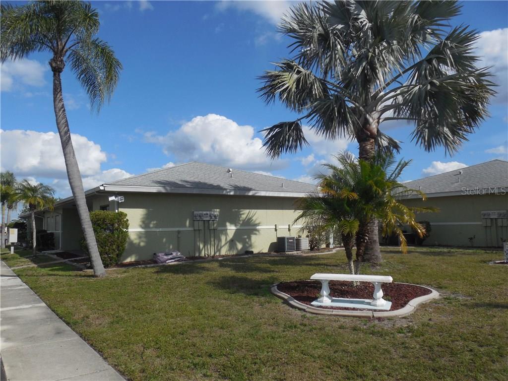 25225 Rampart Boulevard, Unit 1104 Punta Gorda, FL 33983 - Photo 1 of 1 Super location! End unit with park-like view of lake!
