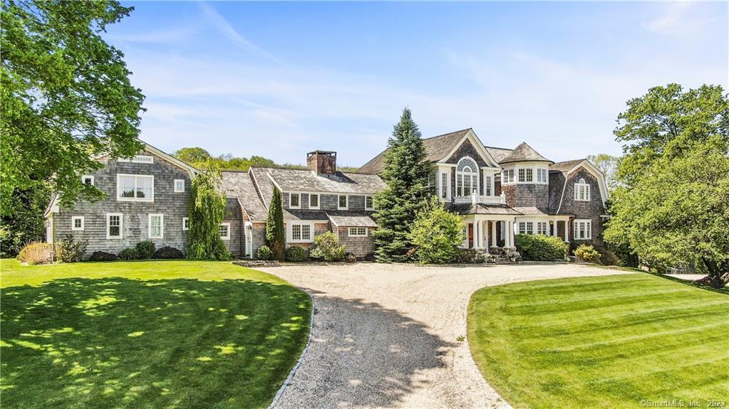 95 Roxbury Road Washington, CT 06793 - Photo 1 of 1 a front view of a building with a garden