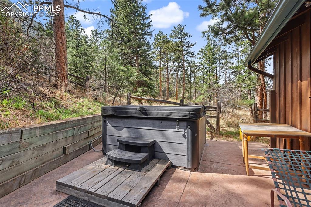 10145 Chipita Park Road Cascade, CO 80809 - Photo 27 of 33 View of flagstone patio featuring a hot tub