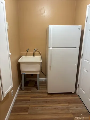 a white refrigerator freezer sitting in a kitchen