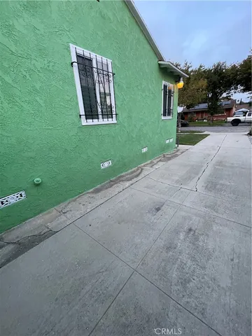 a view of a house with a yard and garage