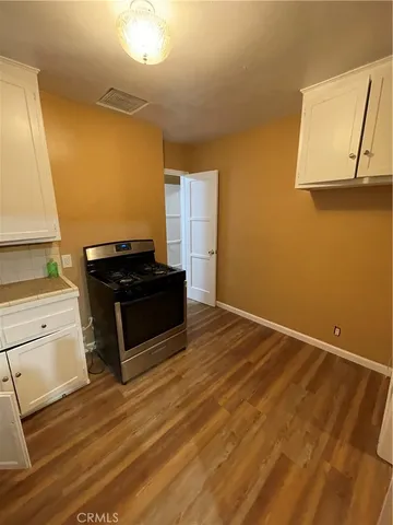 a living room with a bed furniture and a window