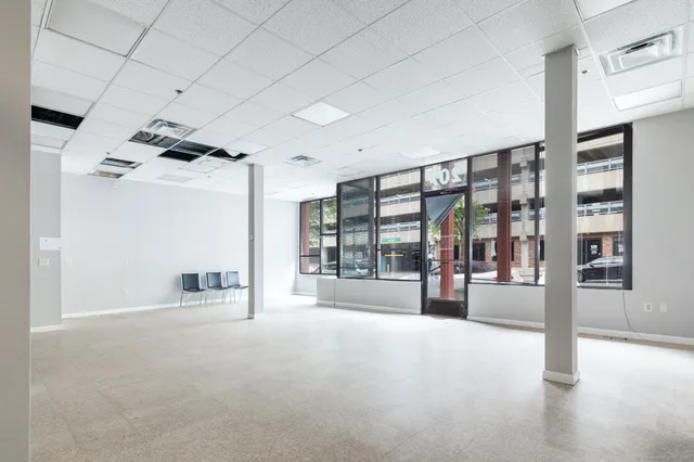 a view of an empty room and a window