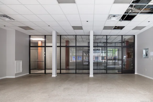 a view of an empty room with windows